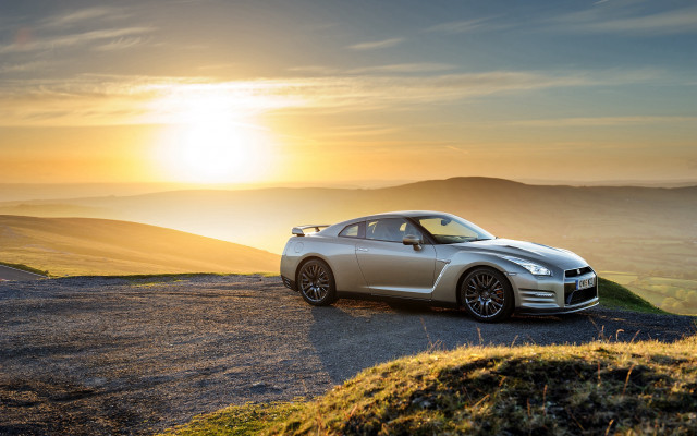 Silver sports car hill sunset free wallpaper for desktop - medium preview image