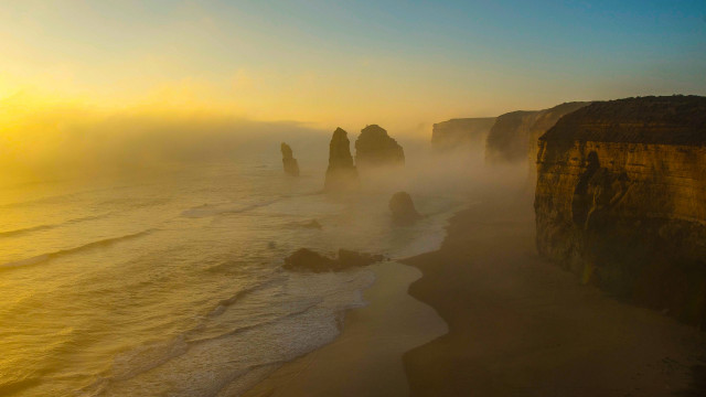Beach cliffs foggy sky water free wallpaper for desktop - medium preview image