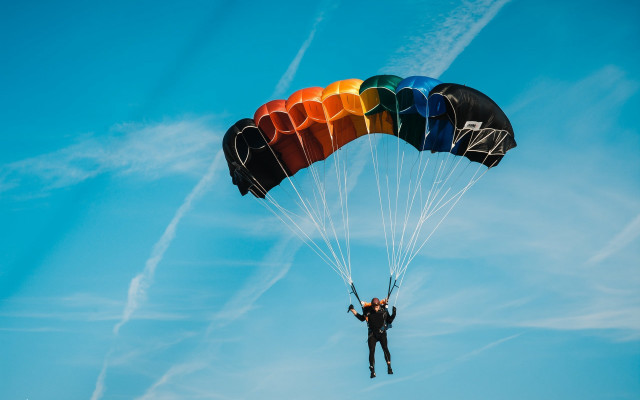 Parasailing rainbow parachute blue sky free wallpaper for desktop - medium preview image