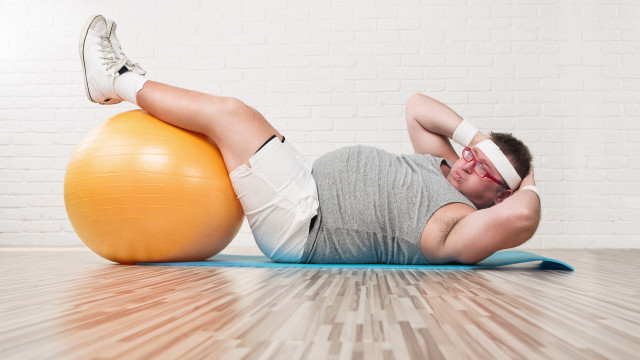 Man laying on ball bandaged free wallpaper for desktop - medium preview image