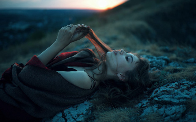 Rocky hillside woman blurry depth free wallpaper for desktop - medium preview image