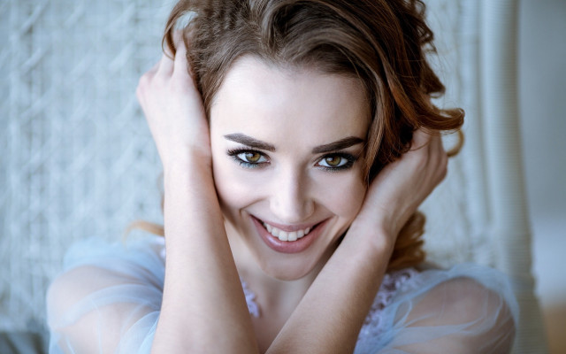 Smiling woman blue eyes hands free wallpaper for desktop - medium preview image