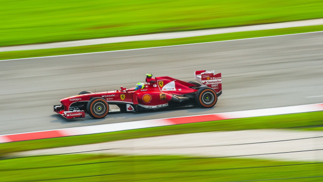 Red race car motion blur #2 free wallpaper for desktop - medium preview image