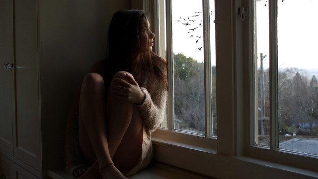 Woman sitting window outside trees free wallpaper for desktop - medium preview image