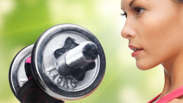 Woman dumbbell green background facial free wallpaper for desktop - medium preview image