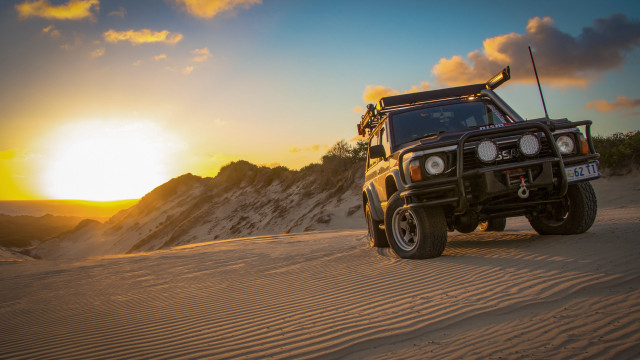 Truck sandy road sunset mountains free wallpaper for desktop - medium preview image
