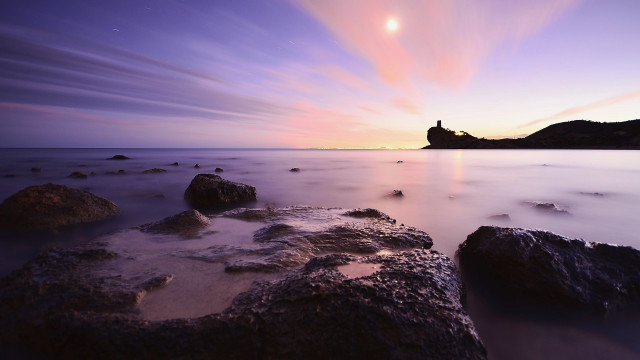 Sunset lighthouse rocky beach purple free wallpaper for desktop - medium preview image