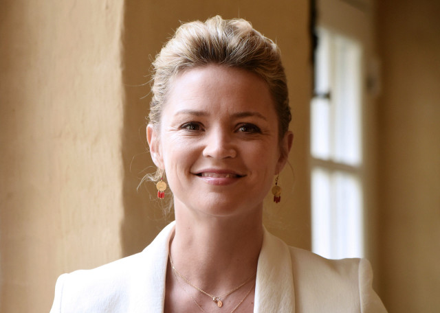 Woman white jacket smiling window free wallpaper for desktop - medium preview image