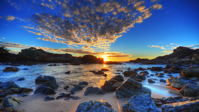 Sunset rocky beach water clouds free wallpaper for desktop - medium preview image