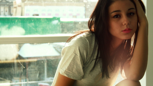 Woman window natural light cityscape free wallpaper for desktop - medium preview image