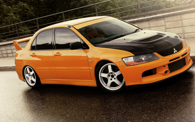 Orange car wet road fence free wallpaper for desktop - medium preview image