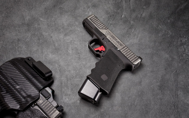 Gun holster gray background red free wallpaper for desktop - medium preview image