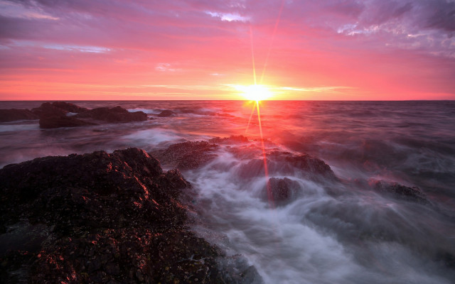 Sunset ocean wave rocks person free wallpaper for desktop - medium preview image