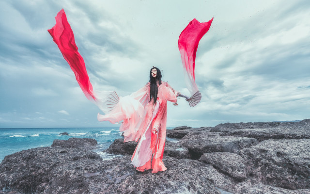 Woman long dress ocean rocks free wallpaper for desktop - medium preview image