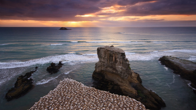 Sunset ocean rock formation island free wallpaper for desktop - medium preview image