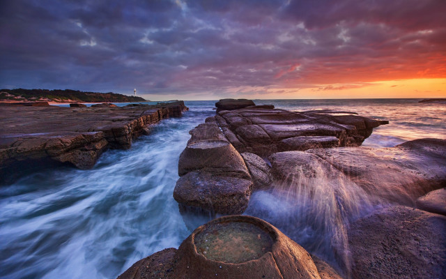 Sunset rocky beach lighthouse cloudy free wallpaper for desktop - medium preview image