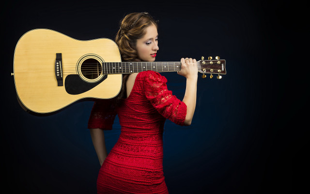 Woman red dress guitar serious free wallpaper for desktop - medium preview image