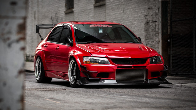 Red car brick building white free wallpaper for desktop - medium preview image