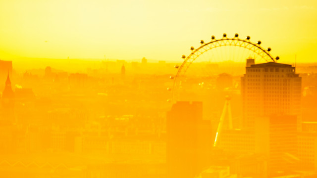 Yellow sky ferris wheel cityscape free wallpaper for desktop - medium preview image