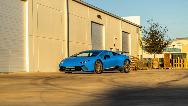 Blue sports car building tree free wallpaper for desktop - medium preview image