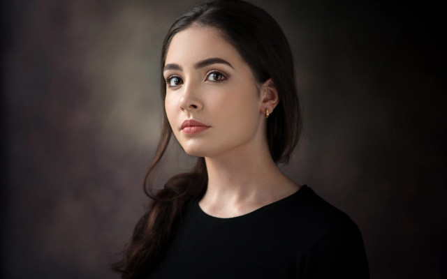 Woman black shirt serious look #2 free wallpaper for desktop - medium preview image