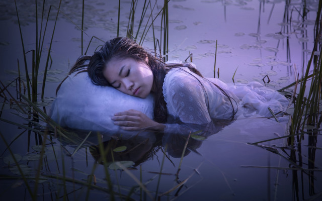 Woman laying water pillow dreamlike free wallpaper for desktop - medium preview image