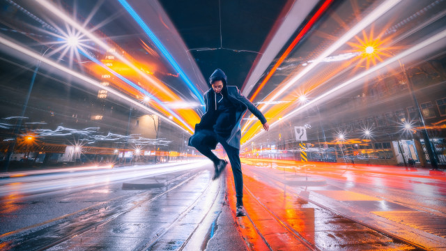Skateboarder wet night city lights free wallpaper for desktop - medium preview image