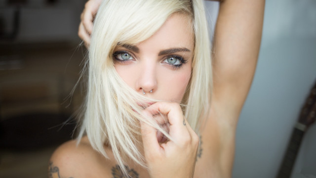 Tattooed woman blue eyes blurry free wallpaper for desktop - medium preview image