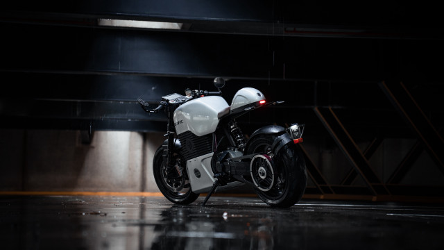 White motorcycle dark room spotlight free wallpaper for desktop - medium preview image