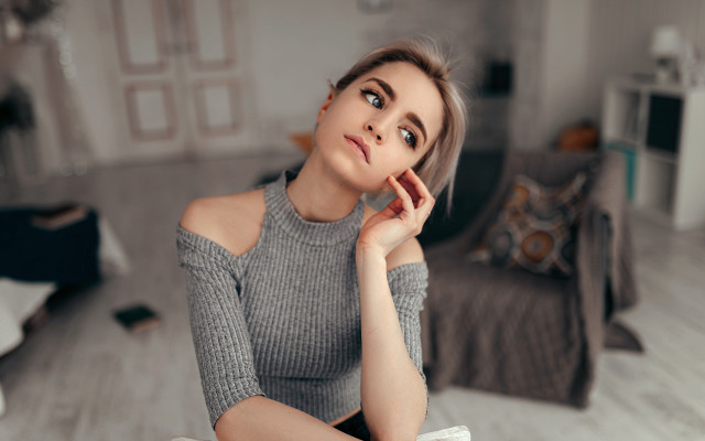 Woman sitting bed gray sweater free wallpaper for desktop - medium preview image