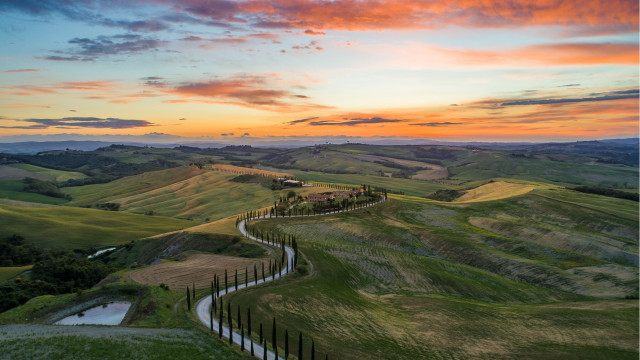Winding road green hills sunset free wallpaper for desktop - medium preview image