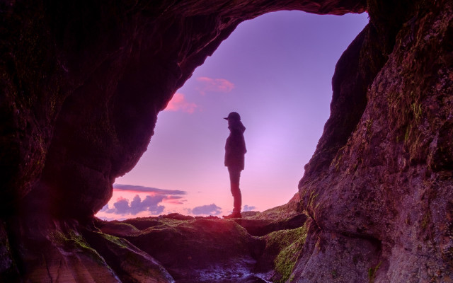Cave person ocean sunset purple free wallpaper for desktop - medium preview image