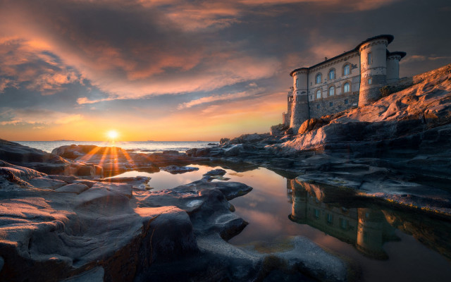 Rocky beach building sunset ocean free wallpaper for desktop - medium preview image