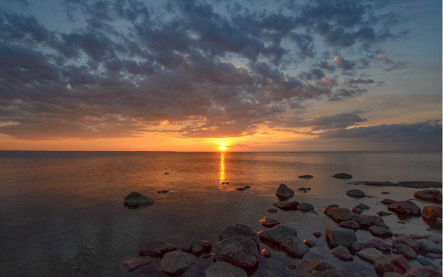 Sunset water rocks city lights free wallpaper for desktop - medium preview image