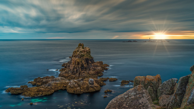 Rock formation ocean lighthouse clouds free wallpaper for desktop - medium preview image