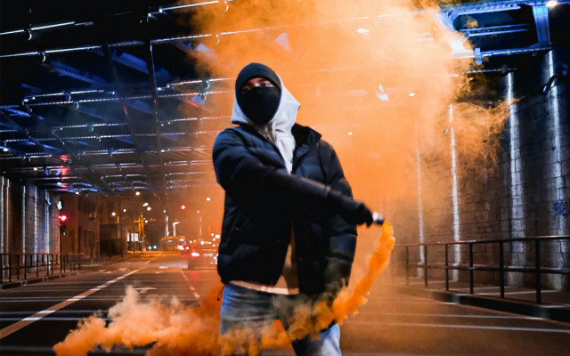 Man black jacket mask yellow free wallpaper for desktop - medium preview image