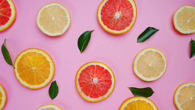 Citrus halves pink background leaves free wallpaper for desktop - medium preview image