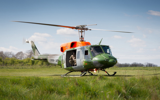 Helicopter man field trees sky free wallpaper for desktop - medium preview image