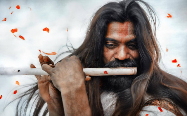 Long haired man smoking leaves free wallpaper for desktop - medium preview image