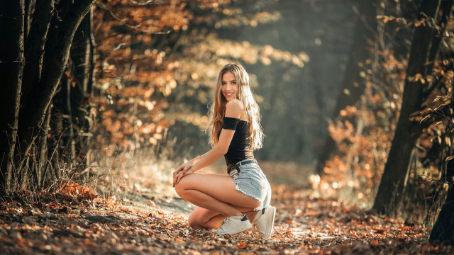 Woman kneeling forest autumn fire free wallpaper for desktop - medium preview image
