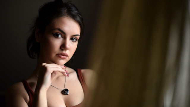 Woman necklace mirror serious portrait free wallpaper for desktop - medium preview image