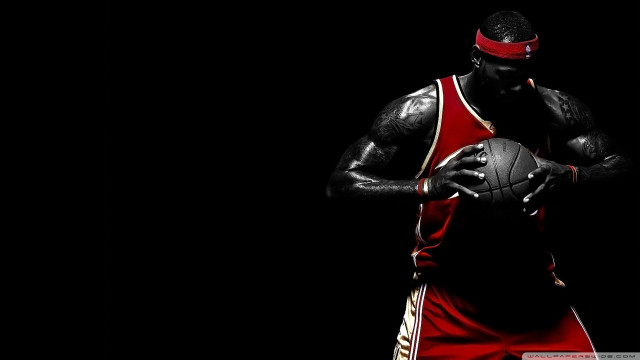 Man holding basketball red uniform free wallpaper for desktop - medium preview image