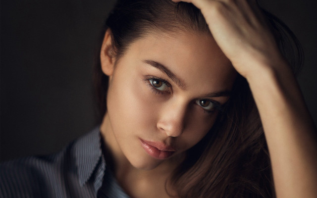 Woman blue shirt black background free wallpaper for desktop - medium preview image