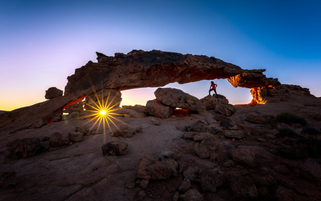 Person rock formation sunset arch free wallpaper for desktop - medium preview image