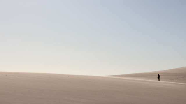 Desert lone person sand dunes #2 free wallpaper for desktop - medium preview image