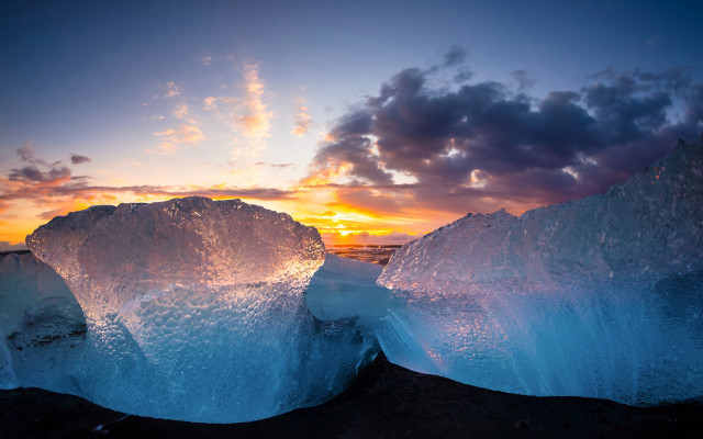 Iceberg beach sunset cityscape clouds free wallpaper for desktop - medium preview image