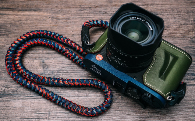 Camera strap lens wooden table free wallpaper for desktop - medium preview image