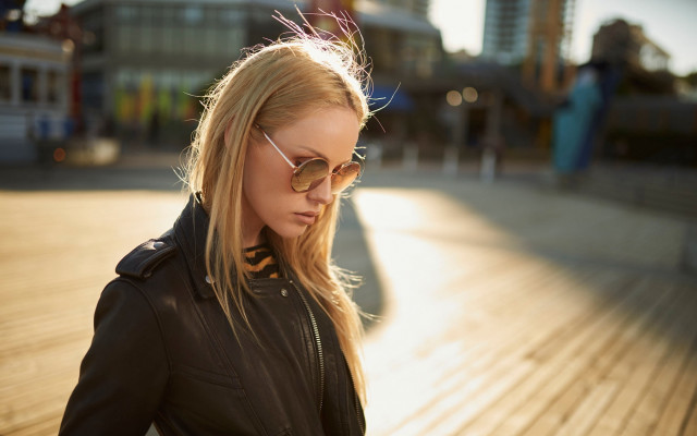 Woman blackjacket sunglasses cellphone boardwalk free wallpaper for desktop - medium preview image