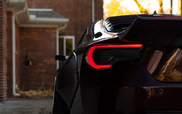 Car brick building red tail free wallpaper for desktop - medium preview image