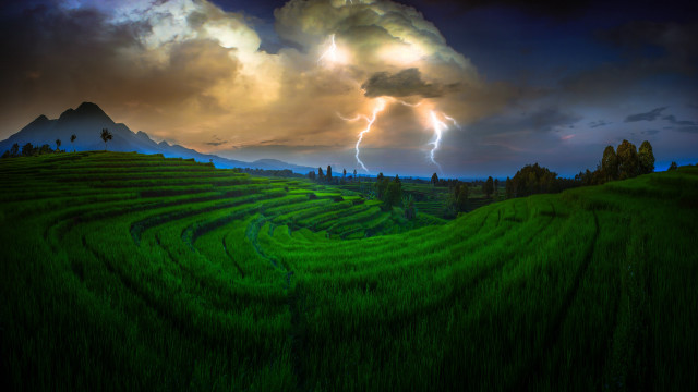 Stormy mountain landscape green field free wallpaper for desktop - medium preview image